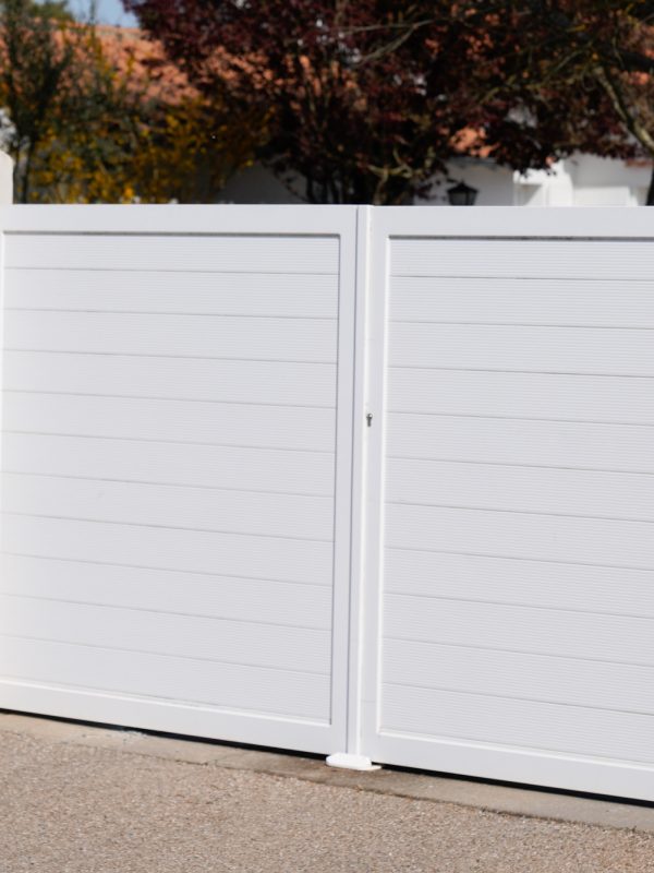 white street private home steel door residential aluminum gate slats portal high house